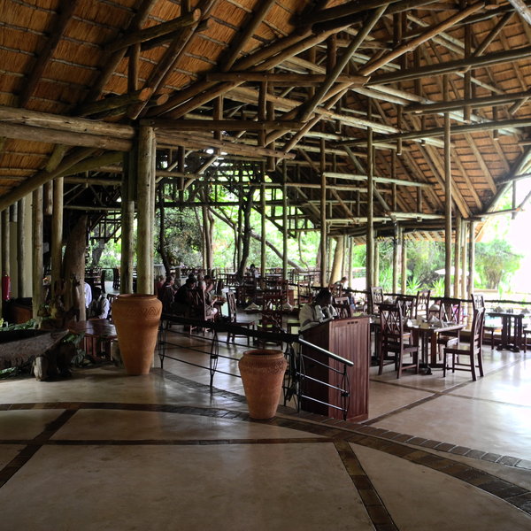 The main building includes the reception, a large restaurant with individual tables,…