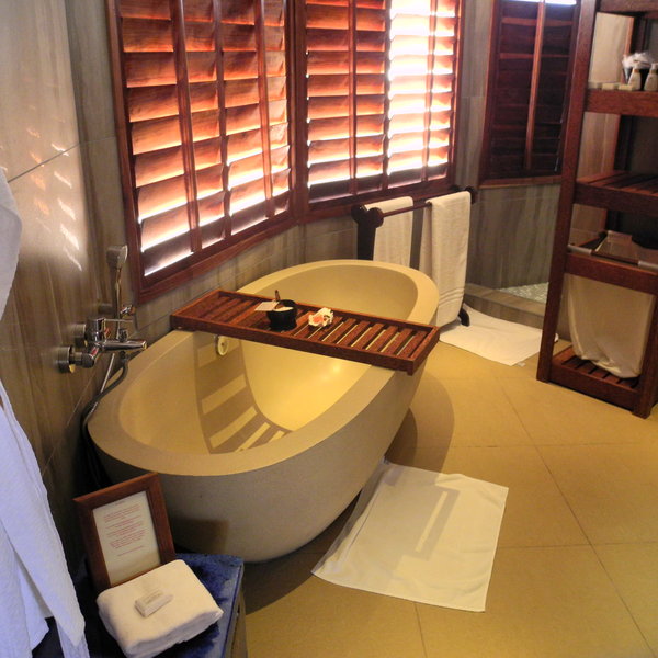 The stylish en suite bathroom is behind the bedroom.