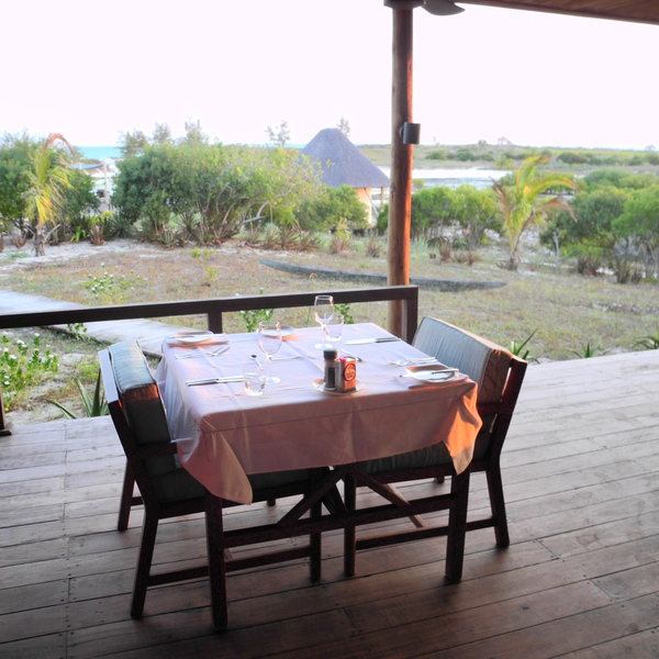 ... with tables elegantly set for meals.