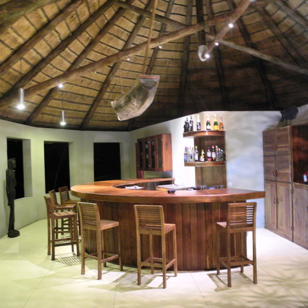 ... and stools around the well-stocked bar.