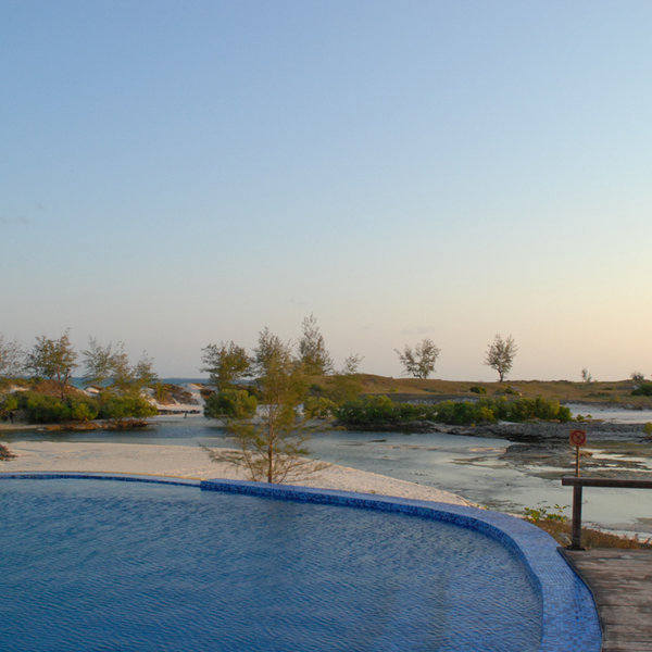 The infinity pool looks out across a lagoon...