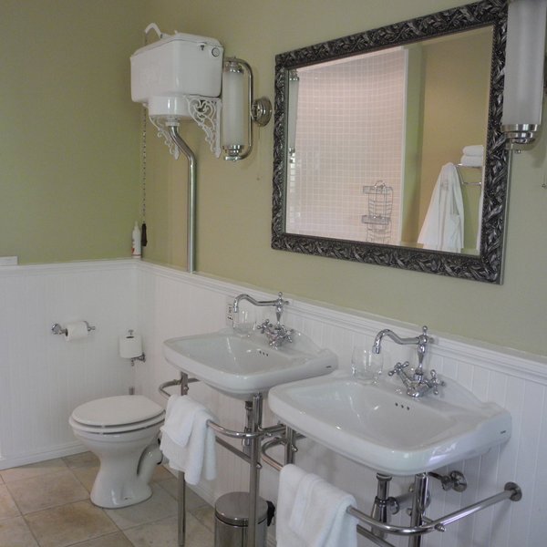 The en-suite bathrooms are spacious with twin basins...