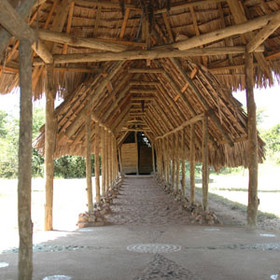 Sandy paths lead to the back of house and to each of the tented rooms.