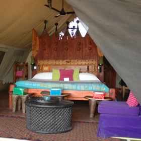 Each tent has a large bed, sitting area and a ceiling fan.