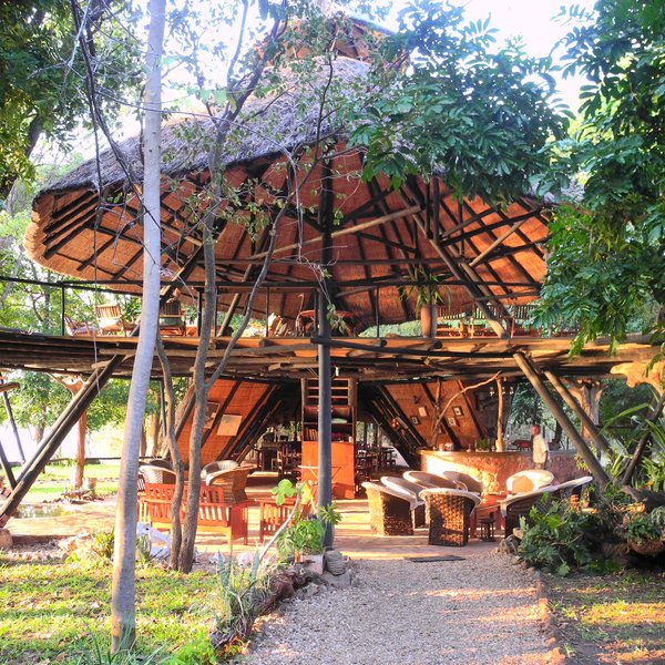 On arrival you are lead straight into the double story main area with its high thatched roofed..