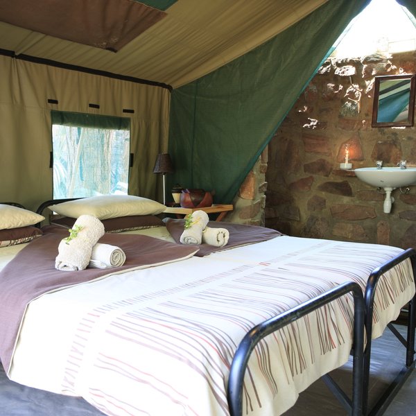 Each of the nine en-suite tents has twin beds.