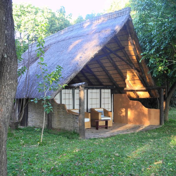 The rooms consists of six chalets situated under tall trees and overlooking the river.