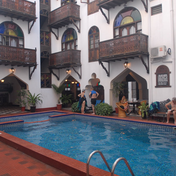 The pool is located in a courtyard in the middle of the hotel.