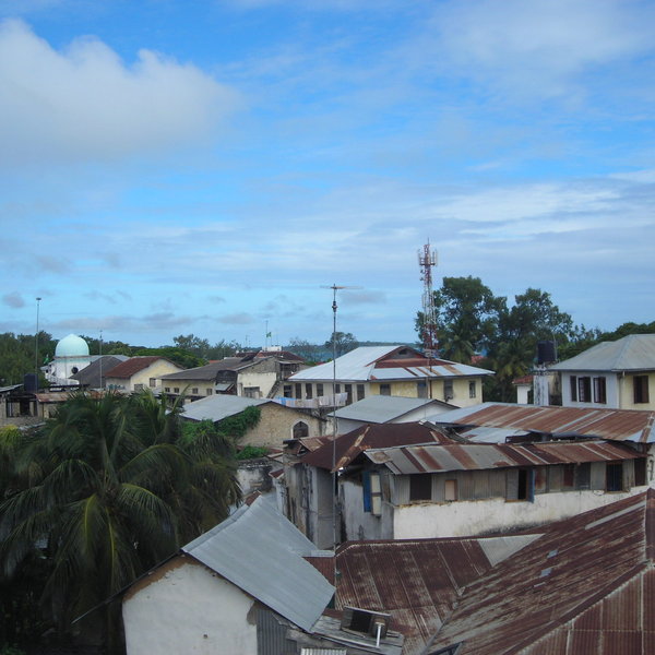 ...Across the multi-coloured iron roofs of Stone Town.