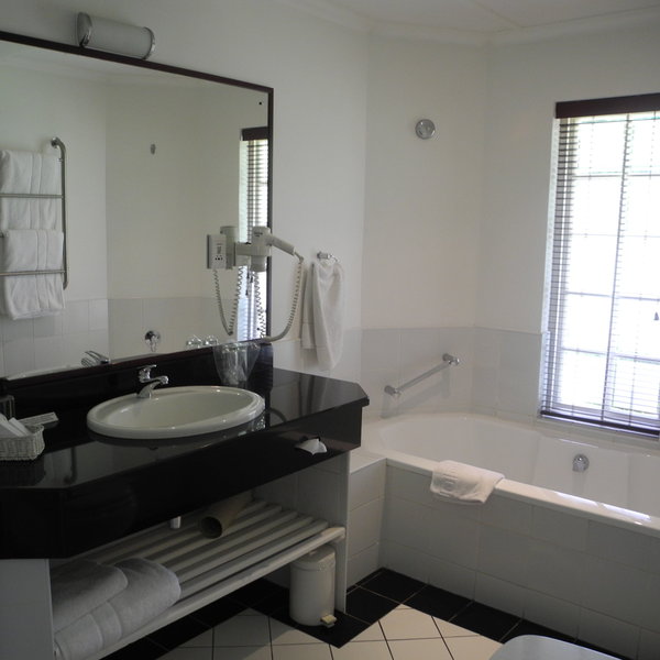 The bathrooms come with separate baths and showers.