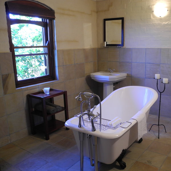 Each room has also its own stone tiled bathroom.
