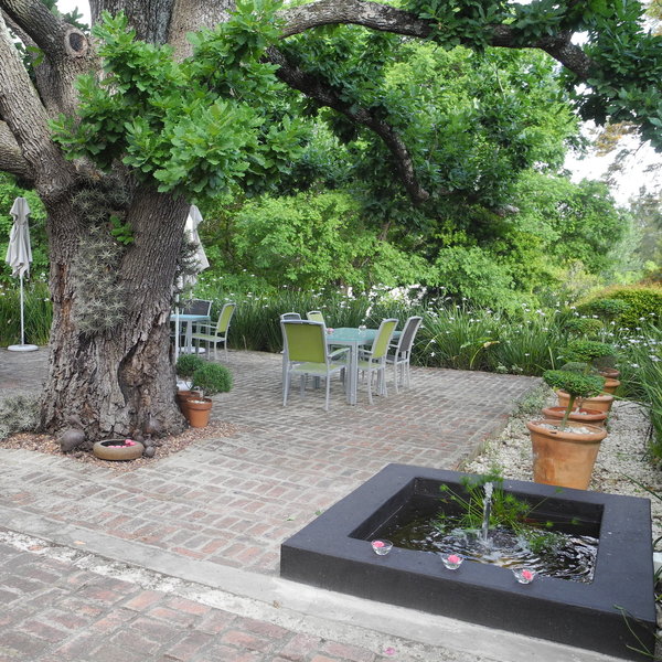 or outside on the patio overlooking the garden.