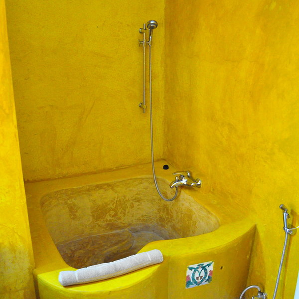 Warm yellows, pinks and reds have been used on the walls adding plenty of colour.