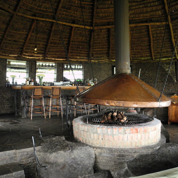A large fire pit keeps the camp bar warm in the cooler months.