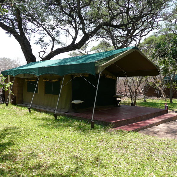 The rooms are dotted about in the lawned gardens.