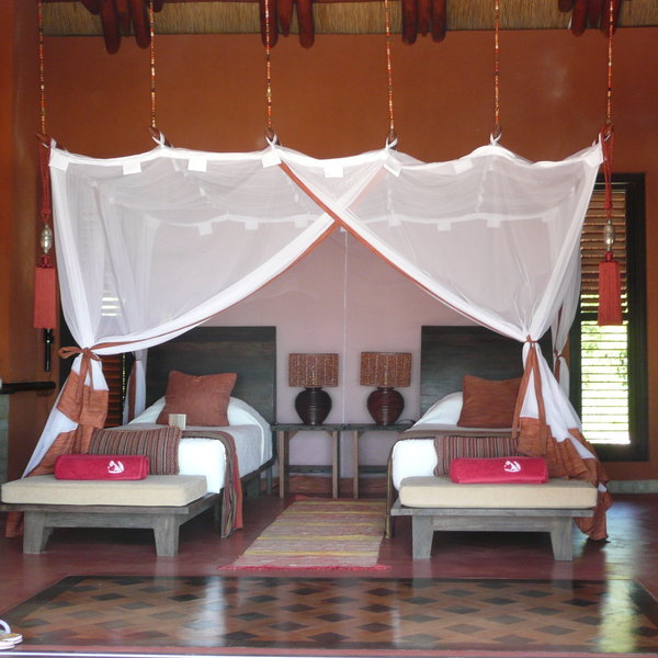 ... with comfortable twin or double beds (well protected from mosquitos).