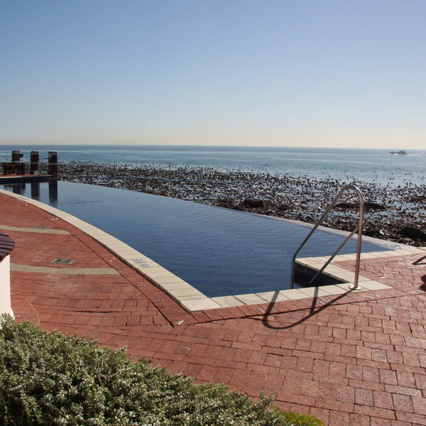 Outside you will find a pool overlooking the beach and the ocean.