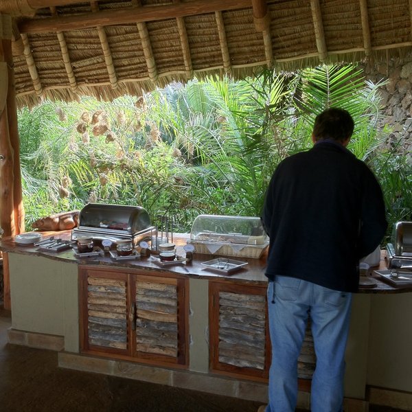 Meals - like this late breakfast - are served informally, with birds and other wildlife all around…