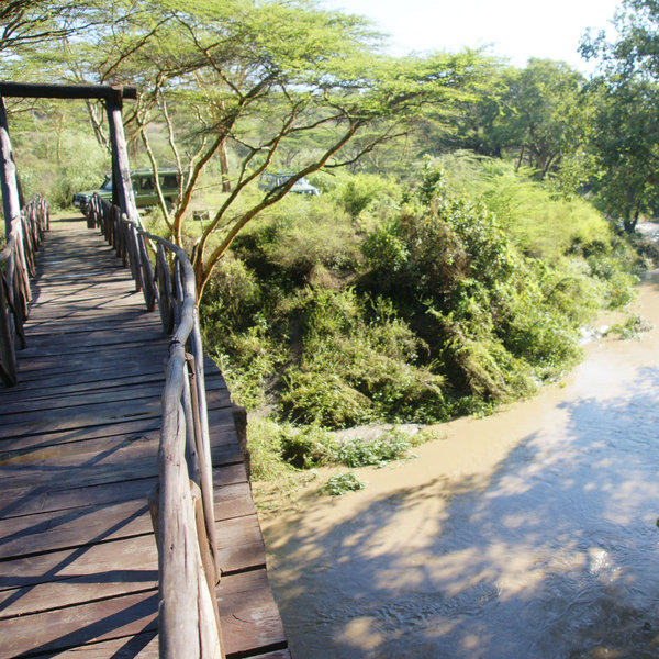 Vehicles stay on the national park side of the Mbagathi River…