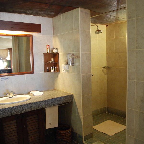 Through the back of the tent is the ensuite bathroom.