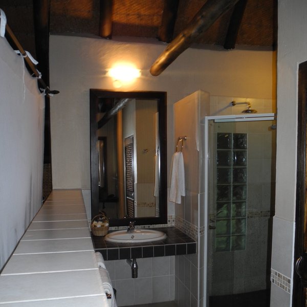 There's an en-suite bathroom at the rear of each chalet...
