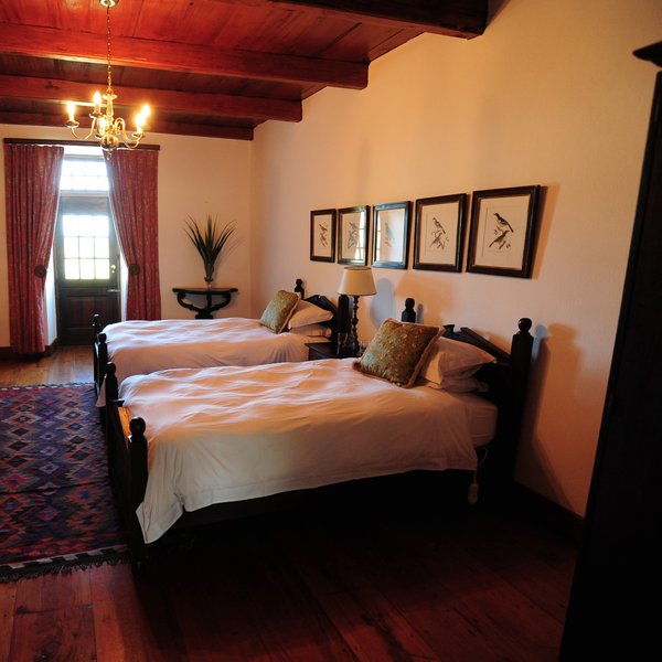 Alternatively, the bedrooms at the Opstal Manor have a more antique touch to them…