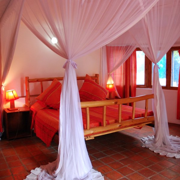 All of them feature a bed enclosed by mosquito netting,…