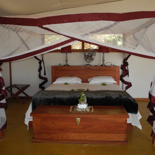 The beds have a walk-in mosquito net around them...