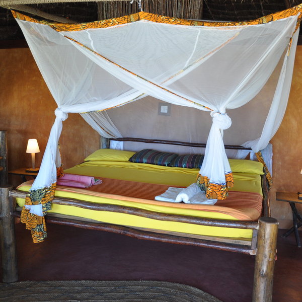 ...with wooden-frame double beds in twin and family rooms...