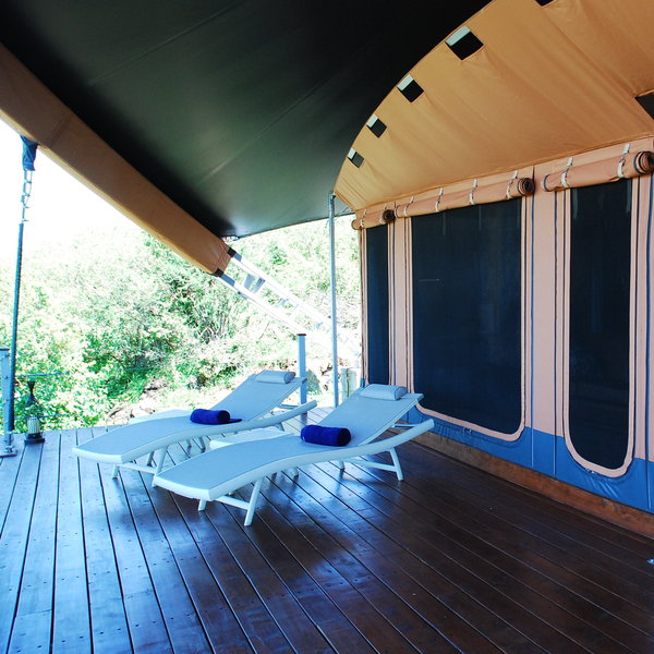 In front is a vast deck which is private and secluded, with loungers….