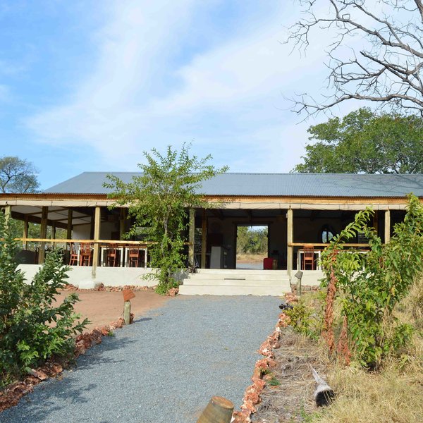 the main communal building is open to the front ...