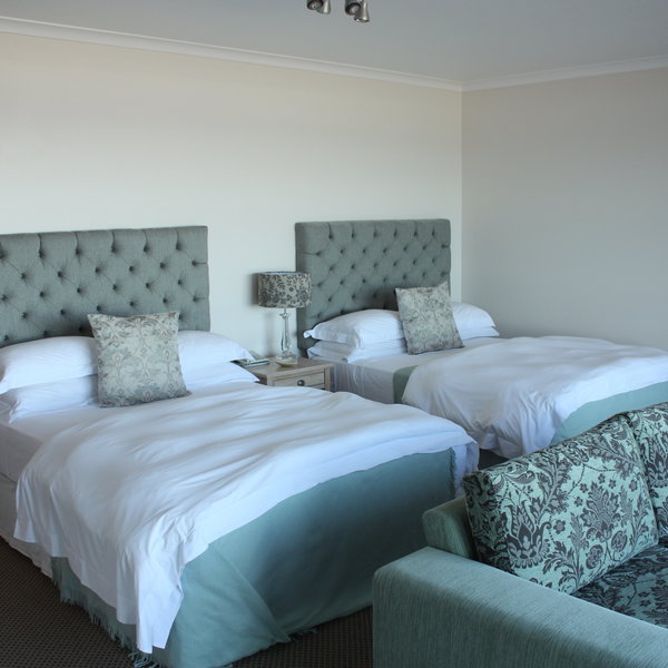 The bedrooms have either twin beds...