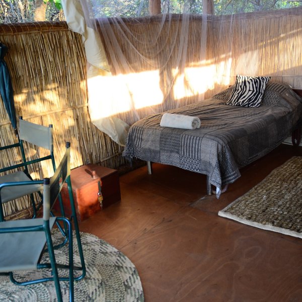 ... which is equipped with two twin beds, directors chairs and table.