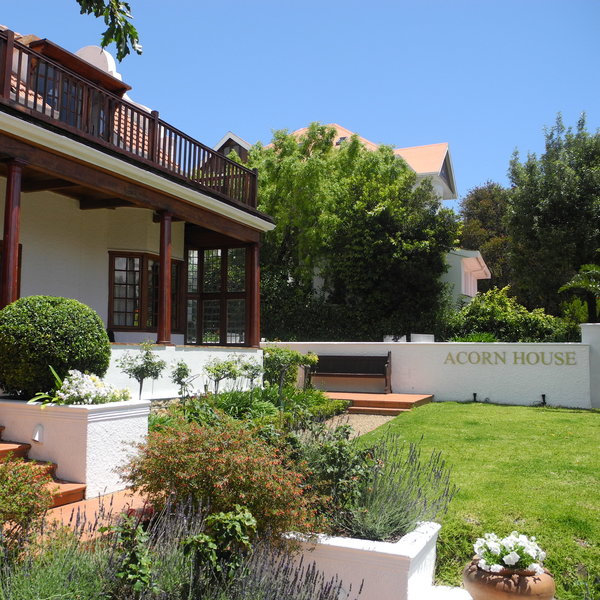 Outside is a small well kept garden..