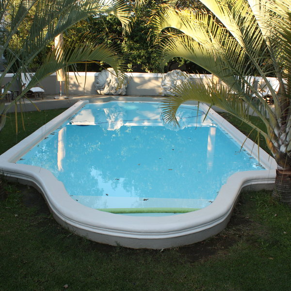 There is an inviting swimming pool...