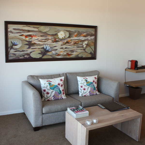 Some rooms have a small seating area...