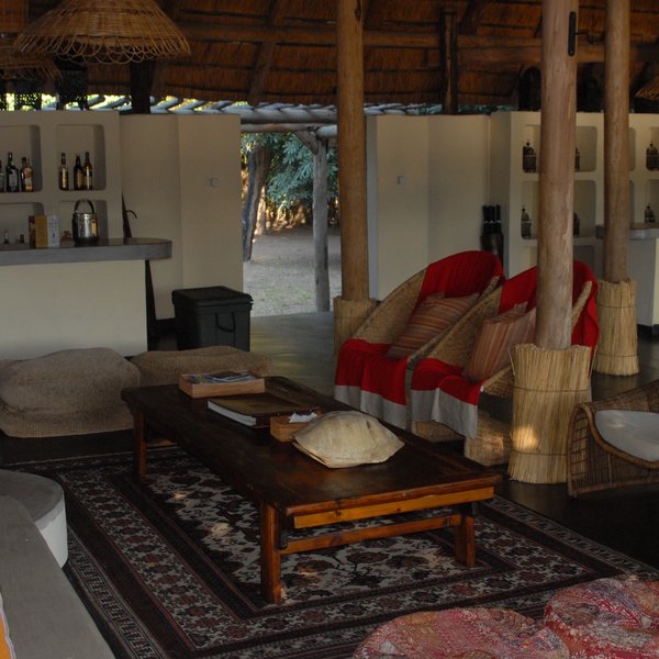 The main area is open plan and consists of a small lounge, bar...