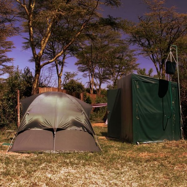 The simple dome tents sleep two adults and have private bathrooms just behind.