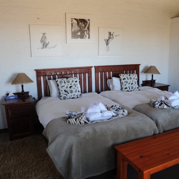 ...and twin rooms decorated with simple paintings.