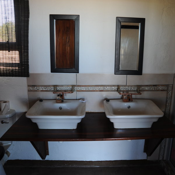 Each room has a bathroom with washbasin...