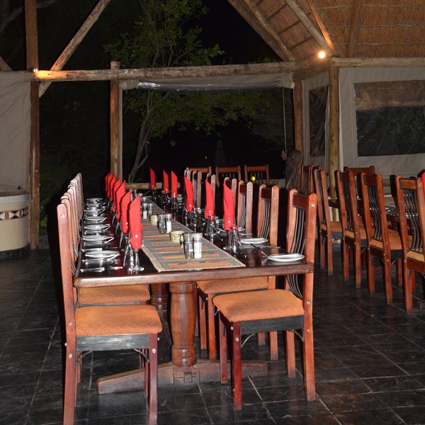 The dining table where meals are usually taken as a group is sizeable.