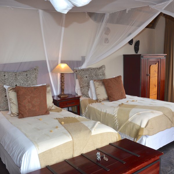 ... double or twin beds with a mosquito net.