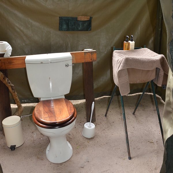 The camp consists of three tents and each of them has a en suite flushing toilet…