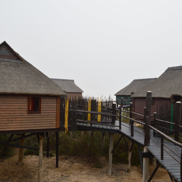 The wooden walkways link the nine high-quality chalets.