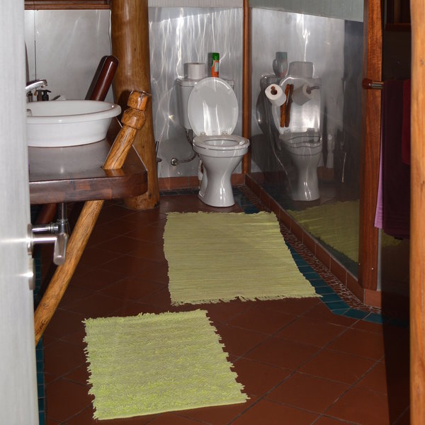 … an en-suite bathroom with a large shower and fluffy towels.