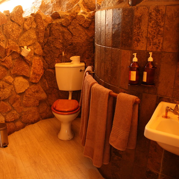 At the back of the chalet is an en-suite bathroom with flush toilet...