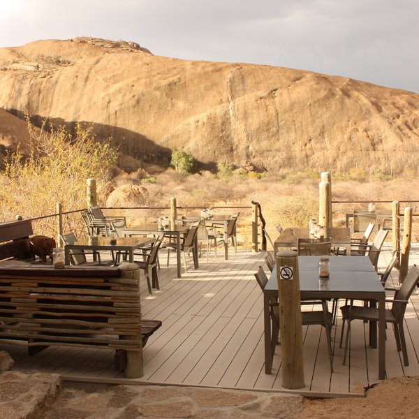 The main area sits atop a separate hill with a spacious outdoor deck with lovely views.
