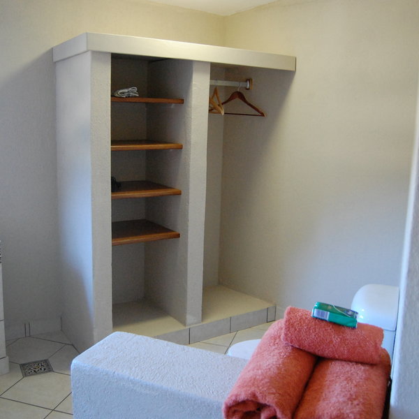 …a wardrobe, a writing desk, a flask with cold water…
