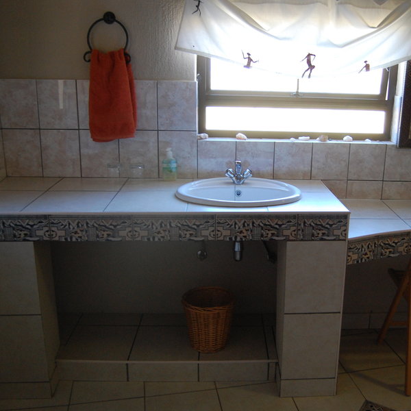The en-suite bathroom is spacious and clean.