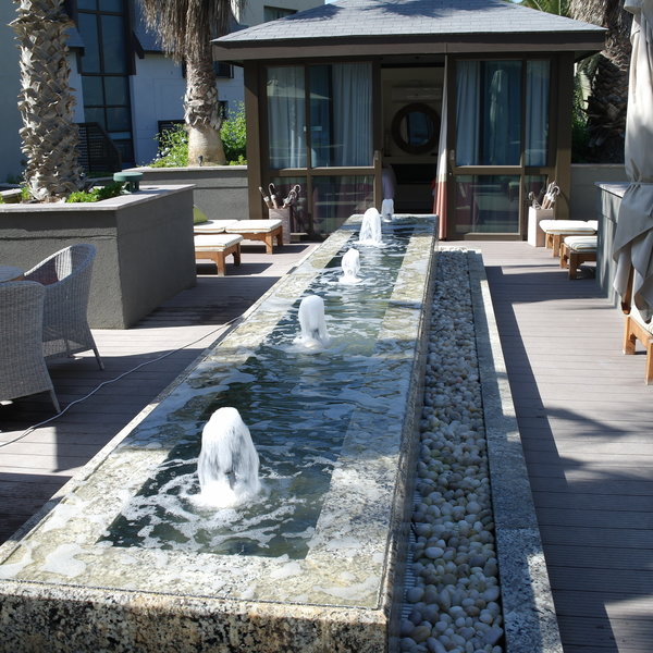 …and a roof-top garden terrace as well as an outdoor therapy suite with fireplace.